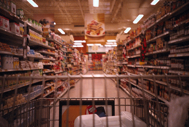 grocery cart in store aisle