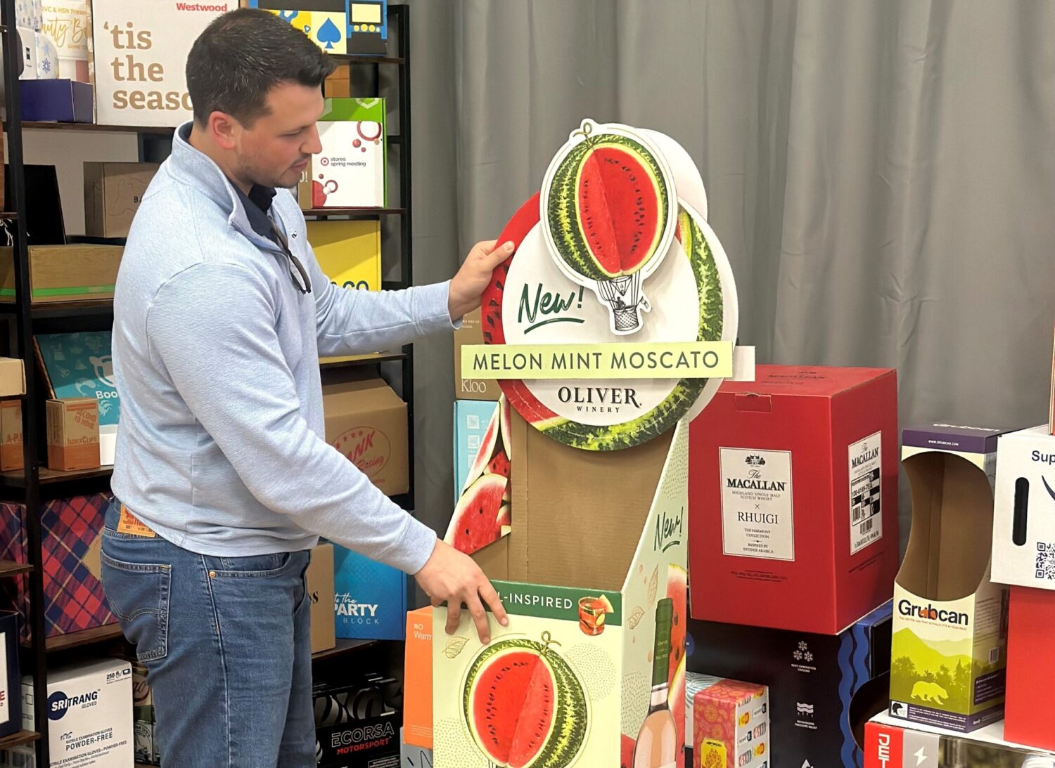 An employee in front of a display